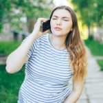 Pregnant woman feeling contractions calling for help